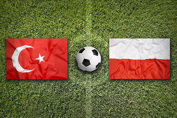 Image showing Turkey vs. Poland flags on soccer field
