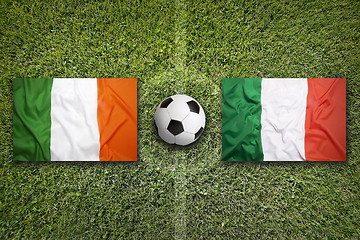 Image showing Ireland vs. Italy flags on soccer field