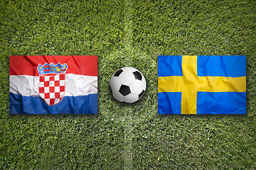 Image showing Croatia vs. Sweden flags on soccer field