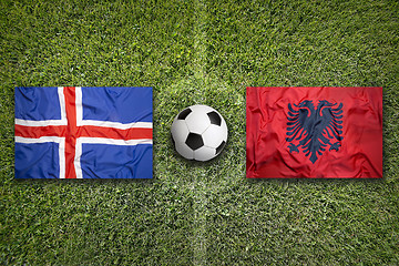 Image showing Iceland vs. Albania flags on soccer field