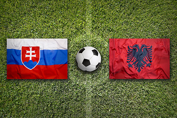 Image showing Slovakia vs. Albania flags on soccer field