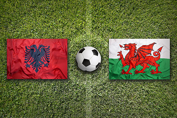 Image showing Albania vs. Wales flags on soccer field