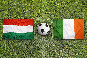 Image showing Hungary vs. Ireland flags on soccer field