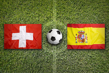 Image showing Switzerland vs. Spain flags on soccer field