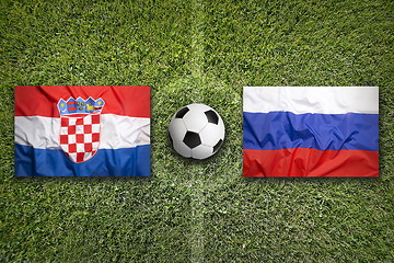 Image showing Croatia vs. Russia flags on soccer field