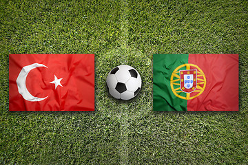 Image showing Turkey vs. Portugal flags on soccer field