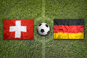 Image showing Switzerland vs. Germany flags on soccer field