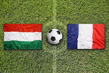 Image showing Hungary vs. France flags on soccer field