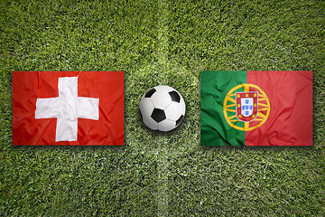 Image showing Switzerland vs. Portugal flags on soccer field