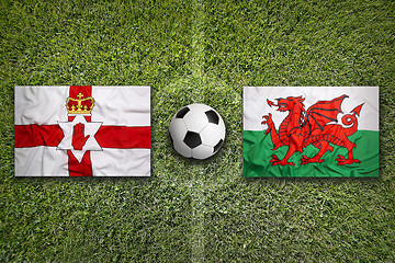Image showing Northern Ireland vs. Wales flags on soccer field