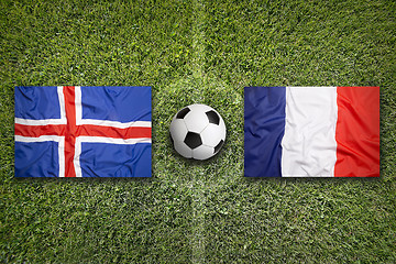 Image showing Iceland vs. France flags on soccer field