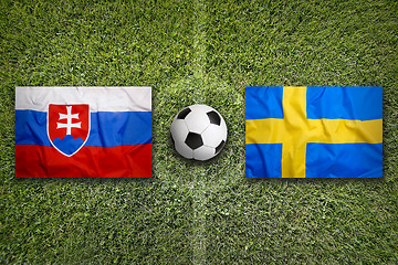 Image showing Slovakia vs. Sweden flags on soccer field