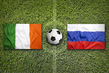 Image showing Ireland vs. Russia flags on soccer field