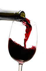 Image showing Red wine pouring into wine glass