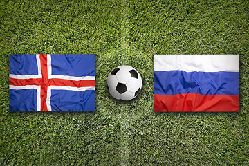 Image showing Iceland vs. Russia flags on soccer field