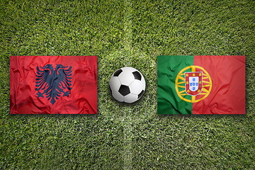 Image showing Albania vs. Portugal flags on soccer field