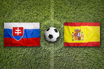 Image showing Slovakia vs. Spain flags on soccer field