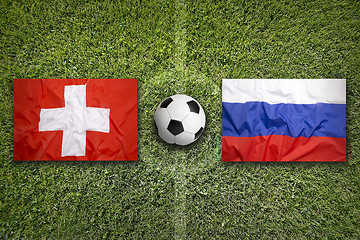 Image showing Switzerland vs. Russia flags on soccer field