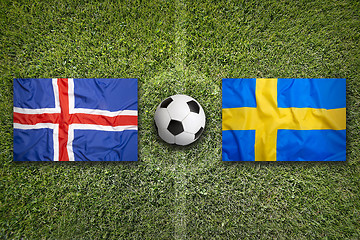 Image showing Iceland vs. Sweden flags on soccer field