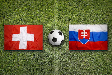 Image showing Switzerland vs. Slovakia flags on soccer field