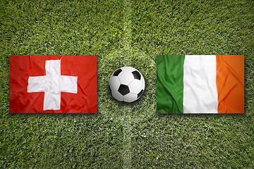 Image showing Switzerland vs. Ireland flags on soccer field