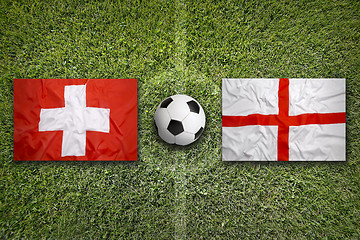 Image showing Switzerland vs. England flags on soccer field