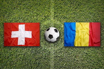 Image showing Switzerland vs. Romania flags on soccer field