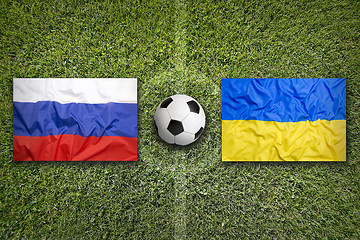 Image showing Russia vs. Ukraine flags on soccer field