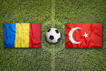 Image showing Romania vs. Turkey flags on soccer field