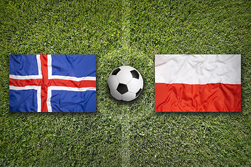 Image showing Iceland vs. Poland flags on soccer field