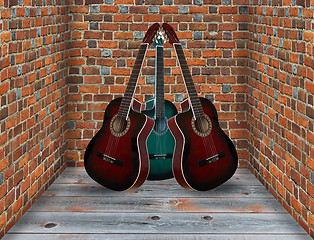 Image showing three guitars in the corner of the room