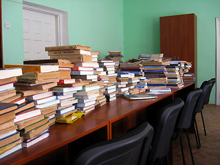 Image showing heaps of books in the library