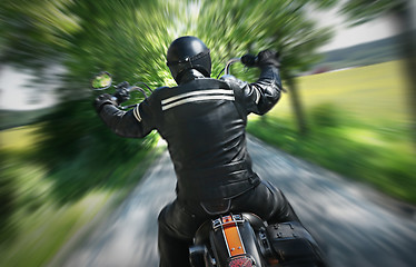 Image showing Lone motorbike rider