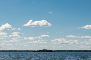 Image showing Beautiful summer lake, on  background of forest and cloudy sky
