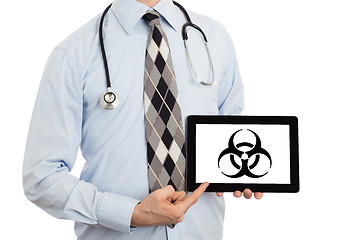 Image showing Doctor holding tablet - Warning! Biohazard!