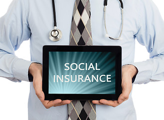 Image showing Doctor holding tablet - Social insurance