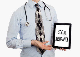 Image showing Doctor holding tablet - Social insurance