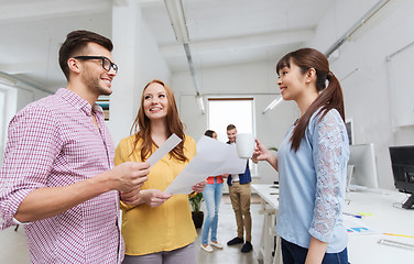 Image showing creative team on coffee break talking at office