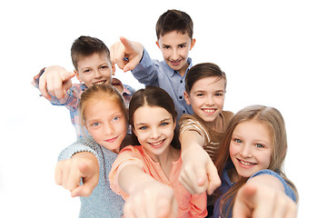 Image showing happy children pointing finger to you