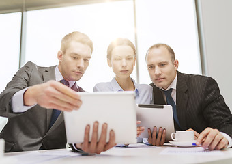 Image showing business team with tablet pc having discussion