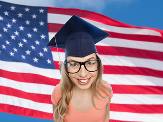 Image showing smiling young student woman in mortarboard