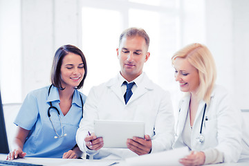 Image showing doctors looking at tablet pc