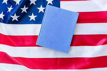 Image showing close up of american flag and book