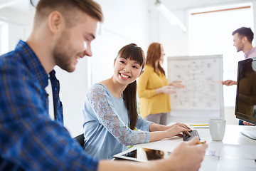 Image showing creative team with tablet pc computer at office