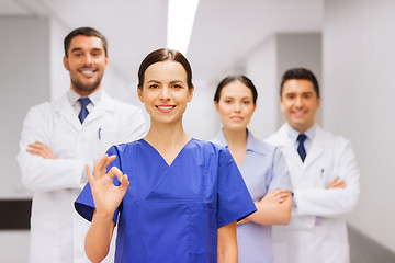 Image showing group of medics at hospital showing ok hand sign