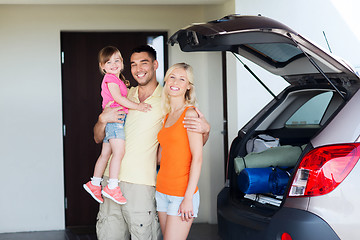 Image showing happy family with hatchback car at home parking