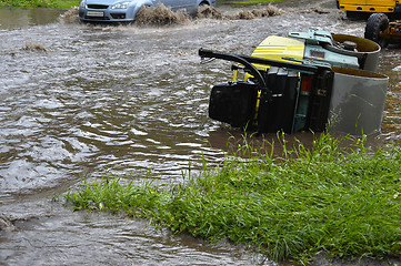 Image showing Car rides in heavy rain on a flooded road