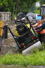 Image showing RUSSIA - MAY 27, 2016: An unidentified man raises overturned tec