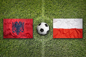 Image showing Albania vs. Poland flags on soccer field