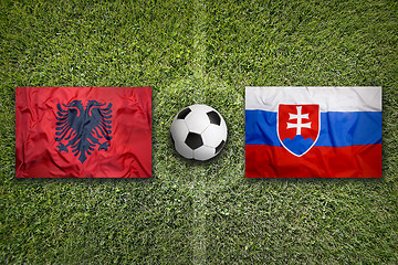 Image showing Albania vs. Slovakia flags on soccer field